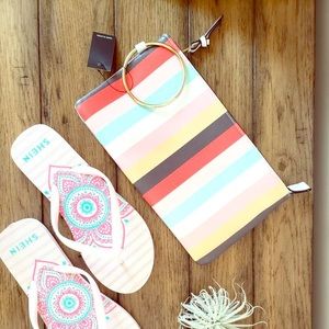 Multi color stripe clutch wristlet with brass ring